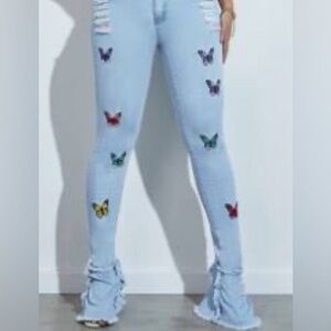 Butterfly print ruffle hem jeans